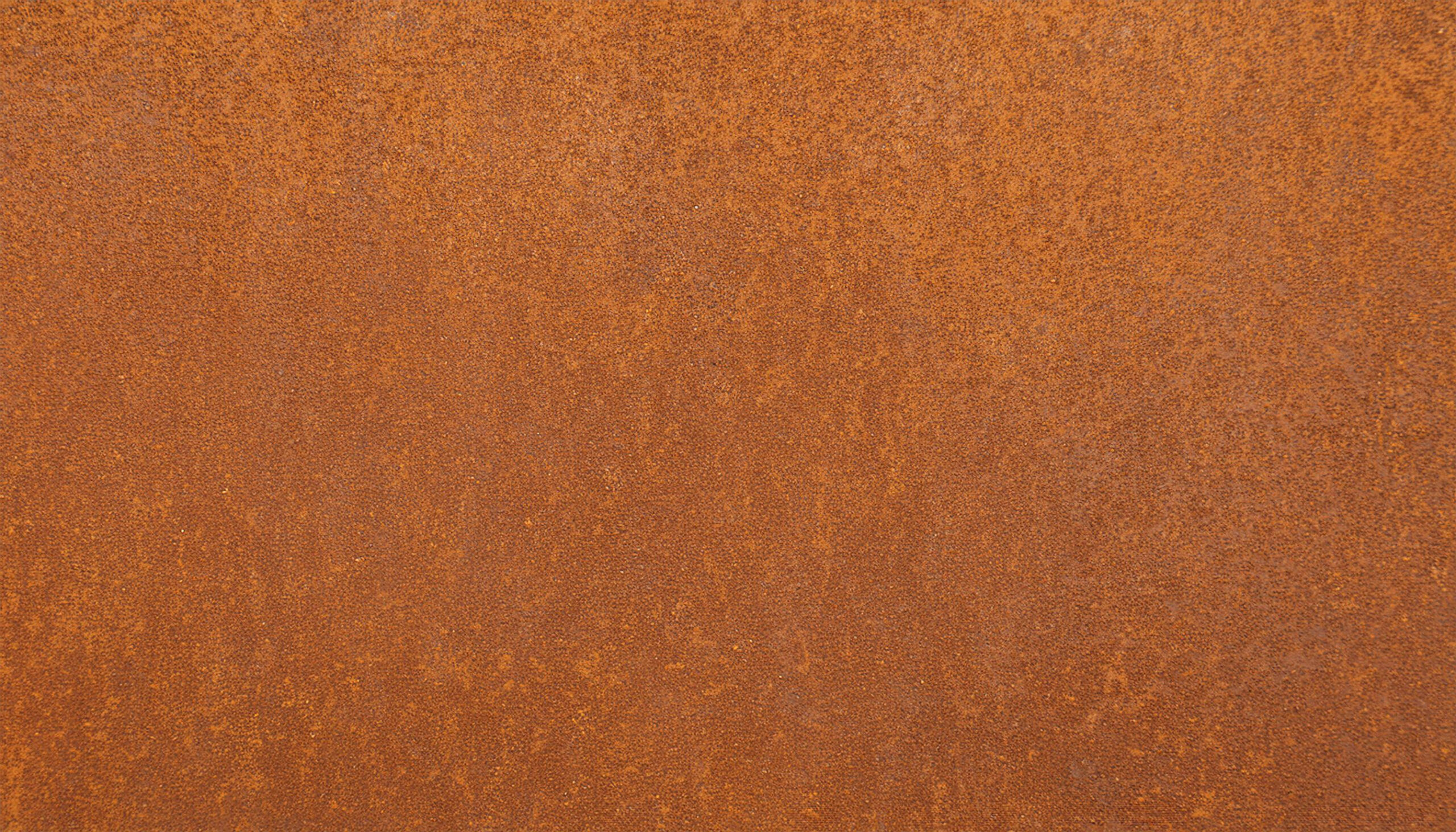 A weathered CorTen steel siding panel. Offered as a custom finish from Metal America