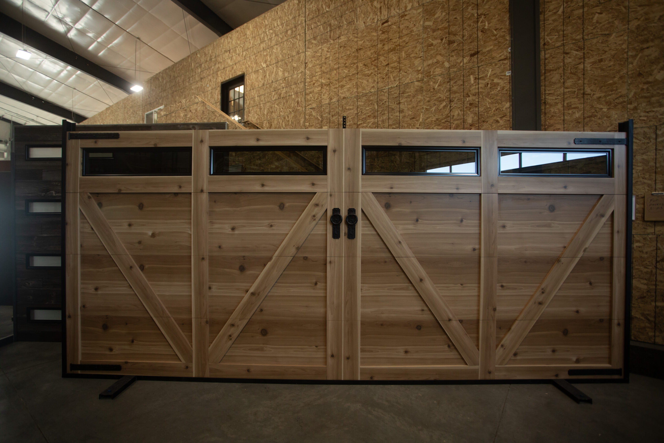 A custom wool-like metal garage door manufactured by Metal America in Post Falls, ID
