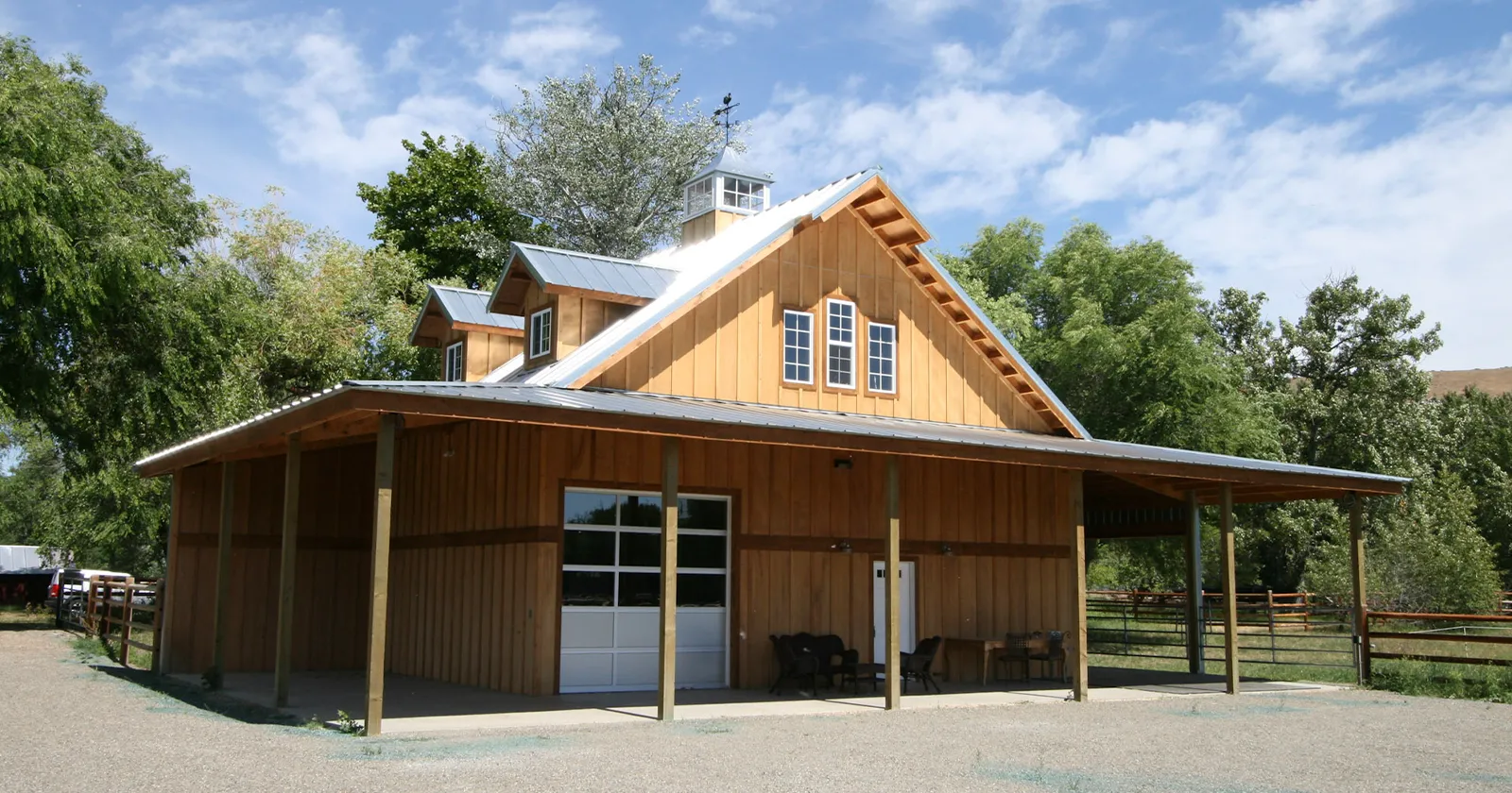 A pole building with metal siding that looks like natural wood