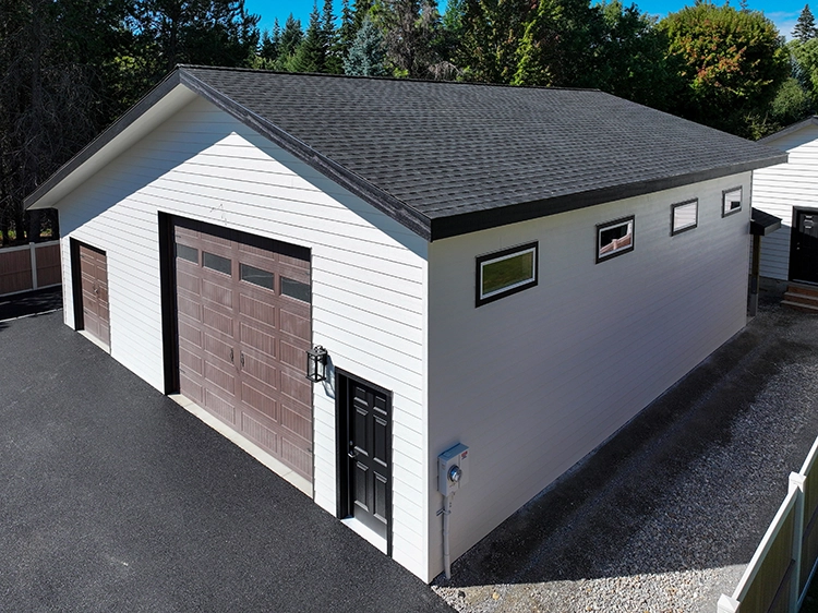 A white garage with steel shiplap siding