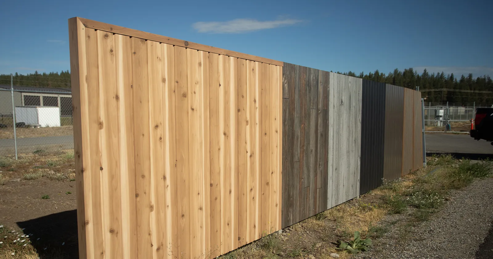 Wood grain metal fence styles are displayed side by side