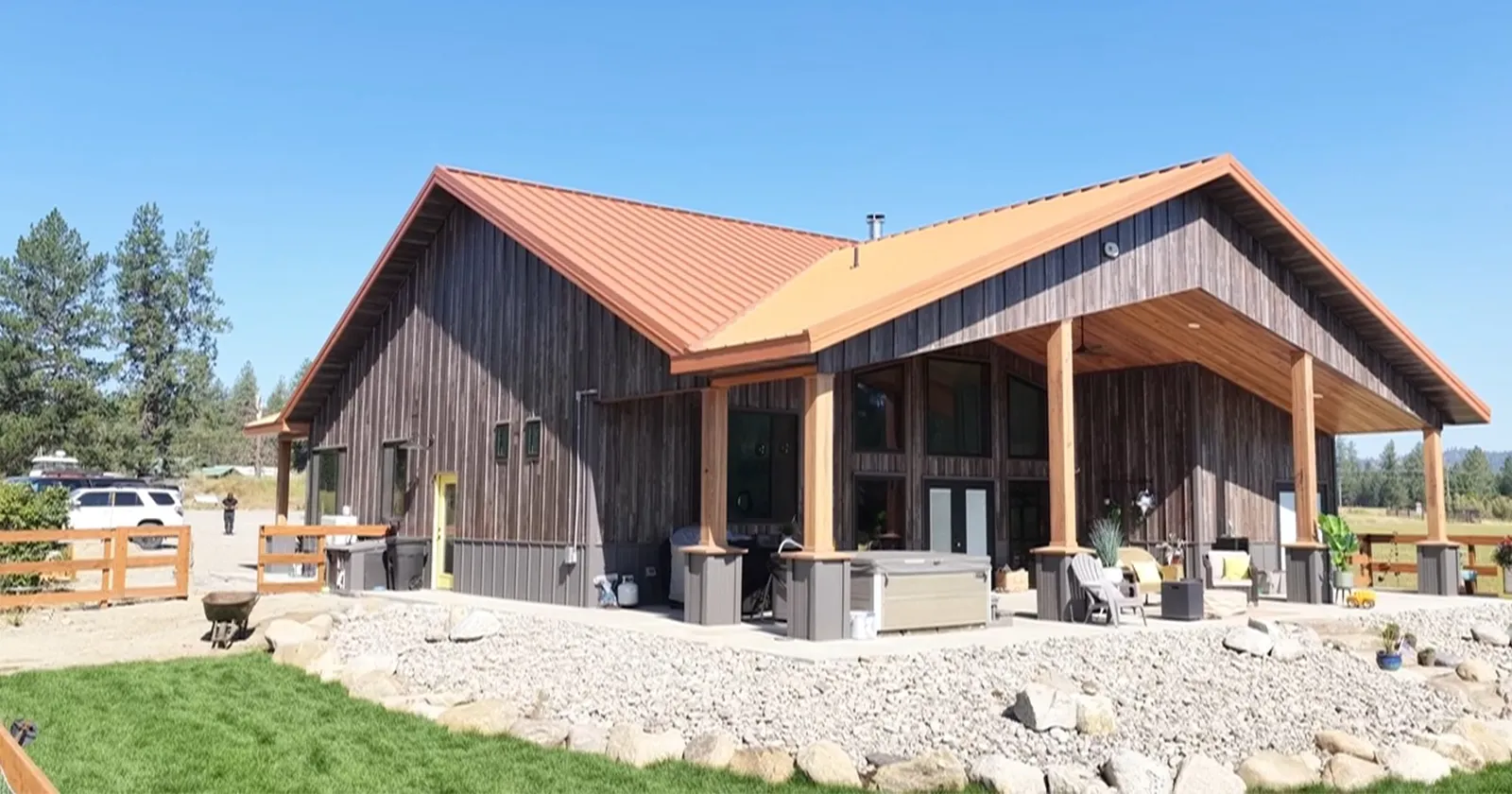 A pole building with metal siding that looks like natural wood