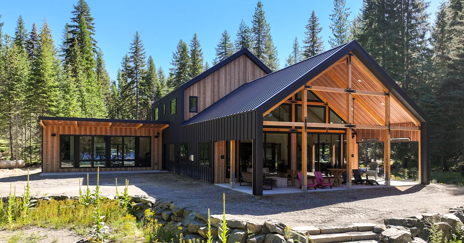 A barndominium with metal siding that mimics the look of real wood