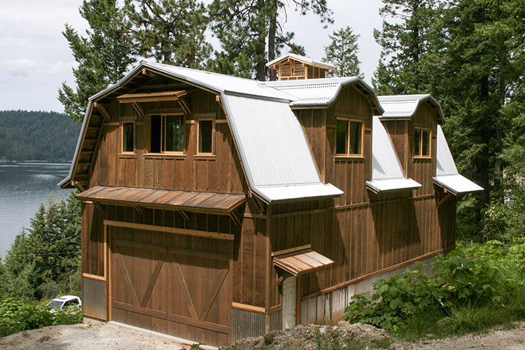 A barndominium built by Steel Structures America featuring Metal Americas roofing panels and wood siding