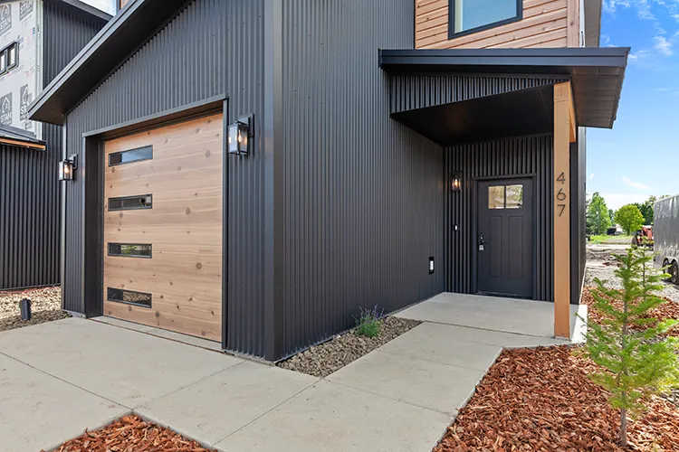 Corrugated metal siding on a Kit Culture home