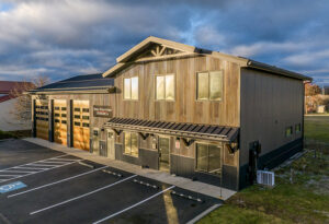 A commercial building with faux rust metal siding panels giving a rusted metal panel aesthetic