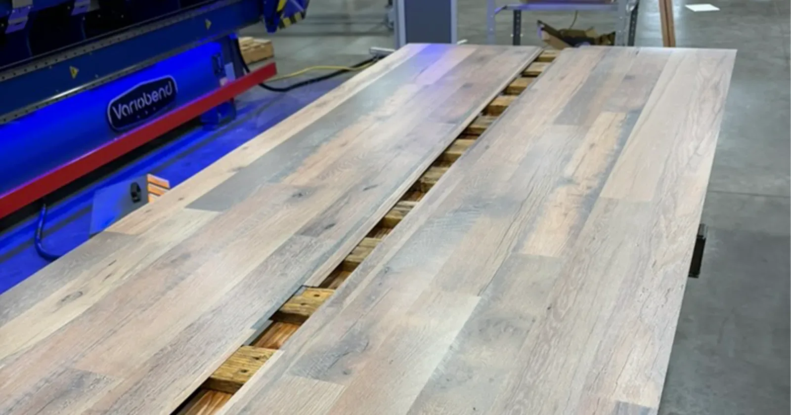 Some cheap to buy metal roofing sheets on a table at Metal America