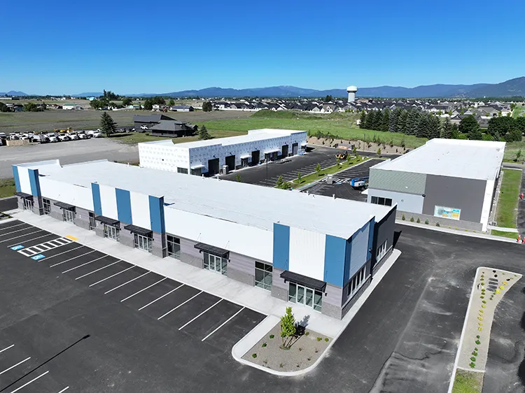Commercial buildings clad in metal roofing and siding, typical of non combustible construction type projects