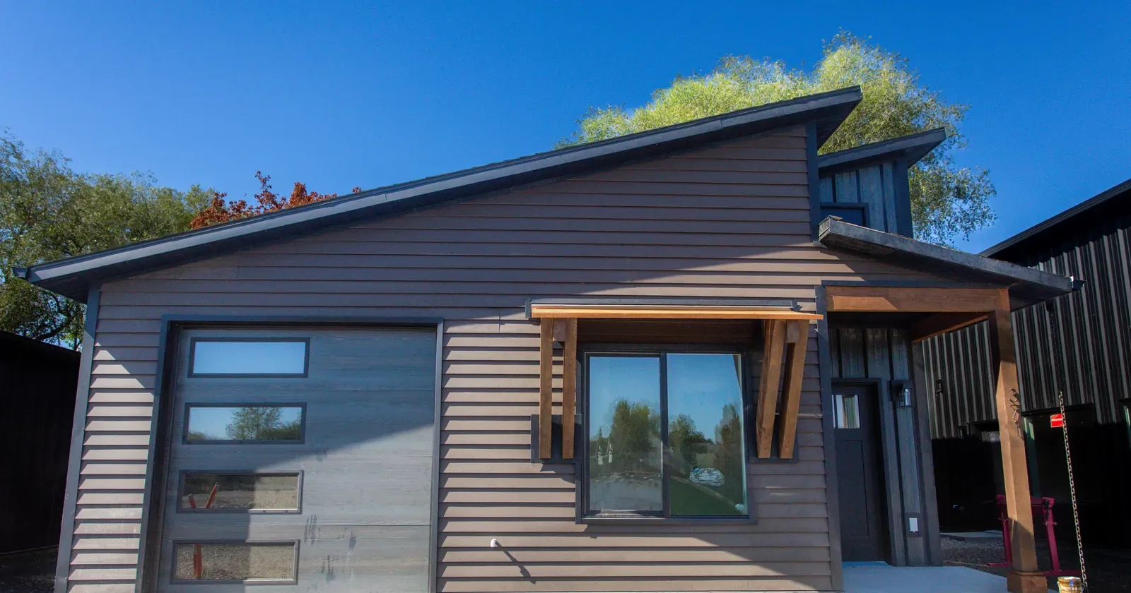 A home with steel roofing, siding and doors, showing exterior fire barrier products working together