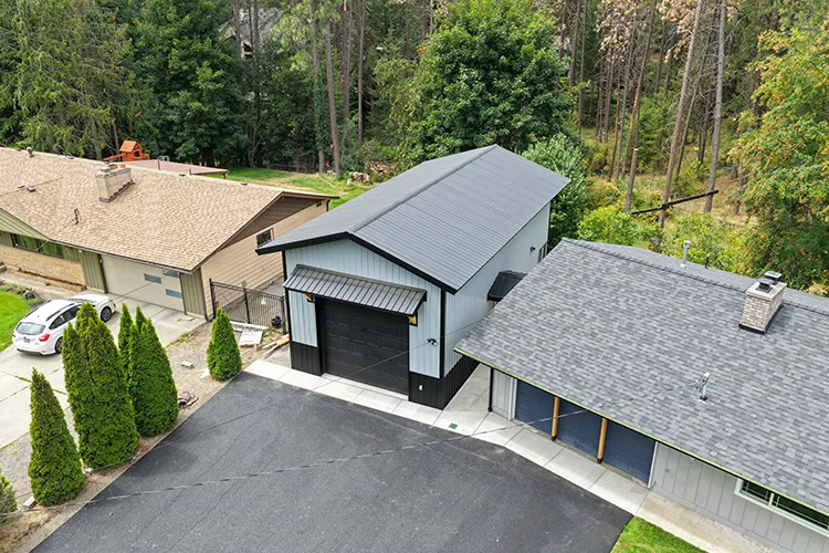 A metal roof between two asphalt shingle roofs, the upgrade that does the most to protect your home from wildfire
