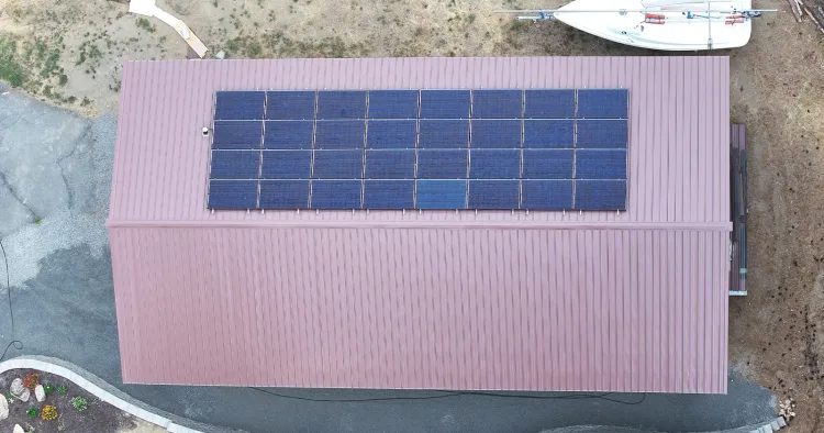 A finished metal roofing installation with solar panels, the standard of work to expect from steel roofing contractors