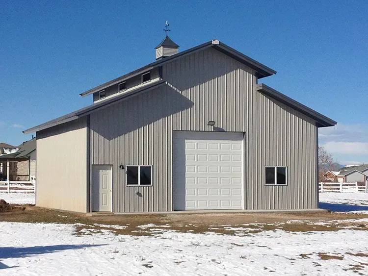 A farm building with ventilated metal roofing, a working example of metal roof vents in service