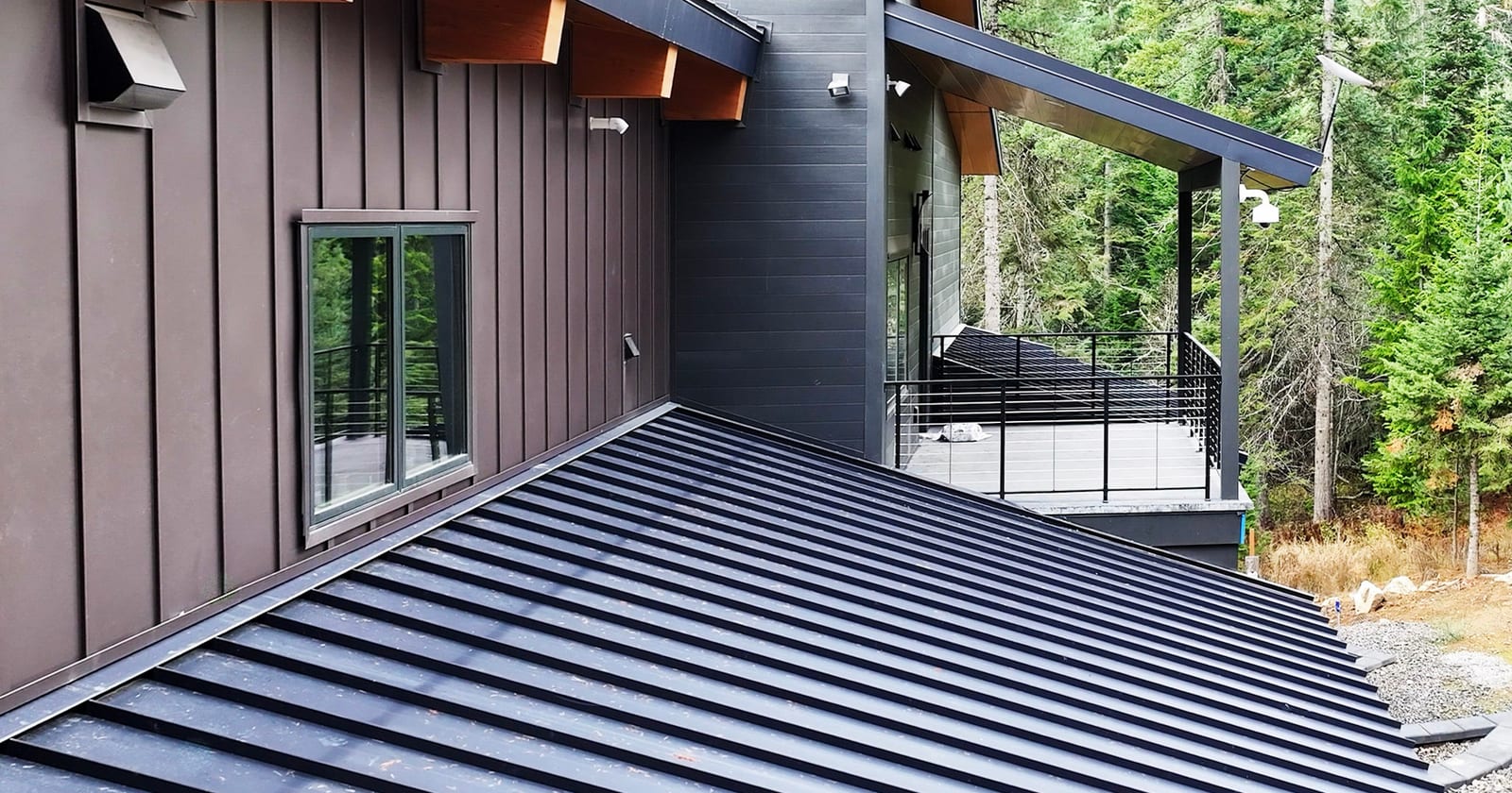 Closeup of wood-printed board and batten steel panels, the profile behind metal board and batten siding near me