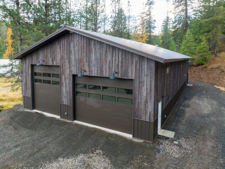Side view of a Barnwood steel pole barn with Burnished Slate roof and corners