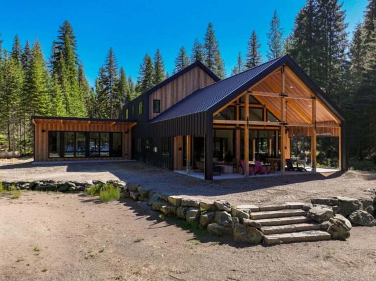Two-story barndominium with Smooth Cedar steel siding and a Gun Metal standing seam roof in Colville, WA