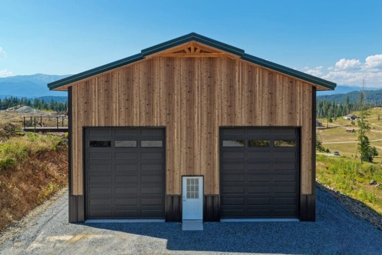 Front gable of a Smooth Cedar shop with a Fern Green PBR Panel roof