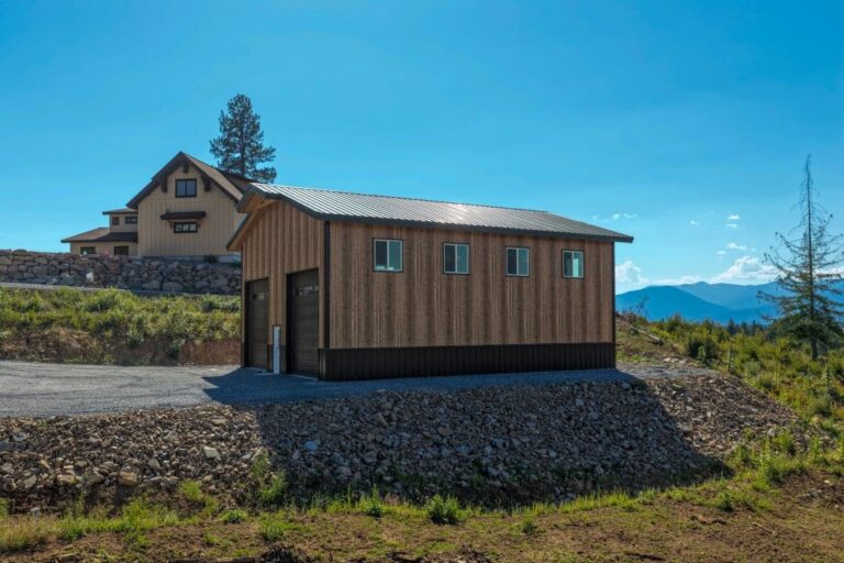 Side wall of a shop with Smooth Cedar siding and a Fern Green metal roof in Sandpoint, ID